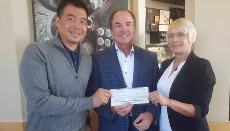 CFP receives funding boost | Picture of Billy Cheung (l), Treasurer of the former Ontario Chain Drug Association of Ontario and Deb Saltmarche, OCDA Chair, present their donation to CFP Executive Director Dayle Acorn holding a cheque - The cnadian Foundation For Pharmacy
