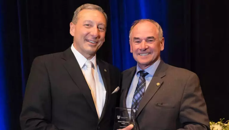 Derek's lessons for pharmacy (and life) | Picture of Derek Desrosiers, left, receives the Lifetime Achievement Award from CFP's Dayle Acorn at the B.C. Pharmacy Association's 2018 conference - The Canadian Foundation For Pharmacy