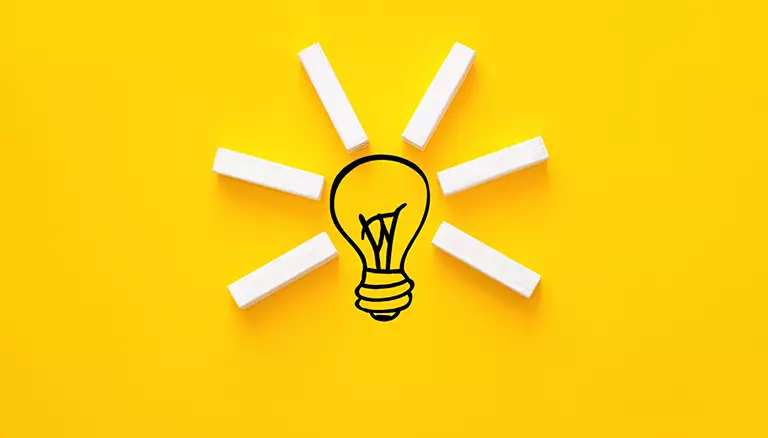 Meet the 2018 Innovation Winners | Concept image of a lightbulb in front of a bright yellow background, symbolizing innovation - The Canadian Foundation For Pharmacy