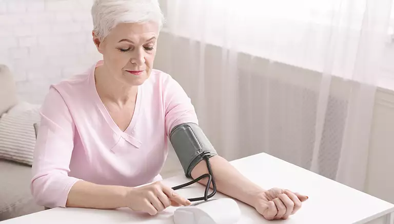 Head start for hypertension certification | Picture of senior lady with hypertension measuring blood pressure - The Canadian Foundation For Pharmacy