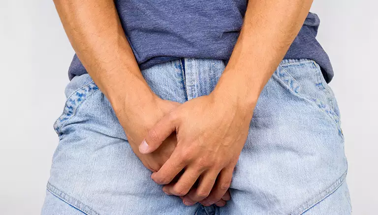 Pharmacists raise patient satisfaction in UTI management | Picture of male putting hands over his crotch area - The Canadian Foundation For Pharmacy