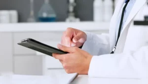 role for real-world data | Picture of scientist looking at data on a tablet - Canadian Foundation for Pharmacy